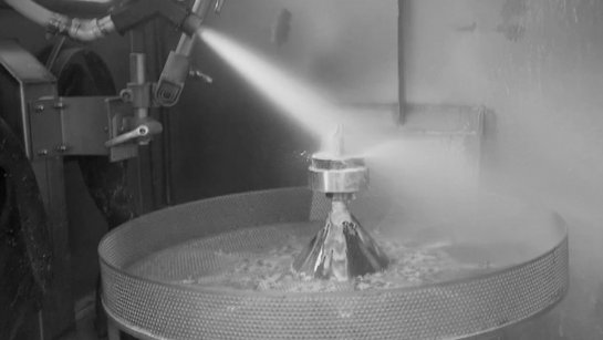 Wet blasting systems for particularly gentle parts processing. Wet blasting system